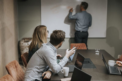 People sitting at business meeting