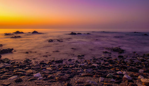 Scenic view of sea against sky during sunset