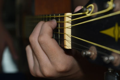 Hand playing guitar