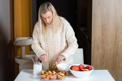 Midsection of woman eating food