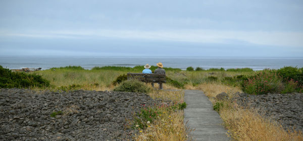 Scenic view of sea against cloudy sky
