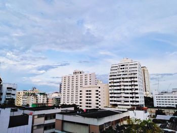 Buildings in city against sky