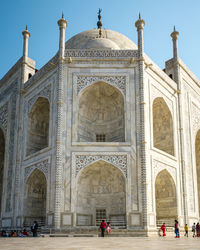 Group of people in front of historical building