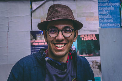 Portrait of smiling young man wearing hat