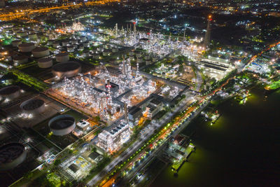 High angle view of city lit up at night