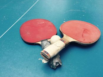 High angle view of table tennis rackets on table