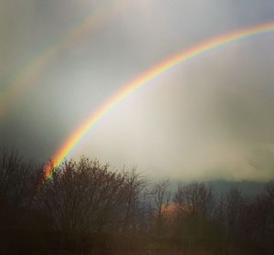 Low angle view of rainbow against sky