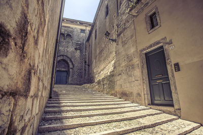 Alley amidst buildings in city