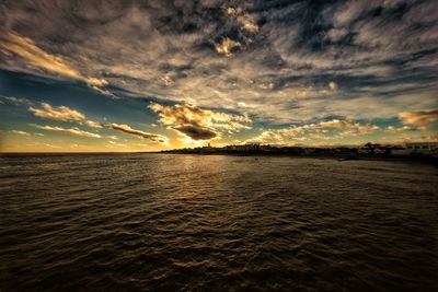 Scenic view of sea against dramatic sky