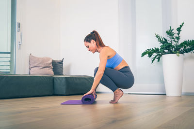 Young woman exercising at home