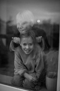 Children looking through window