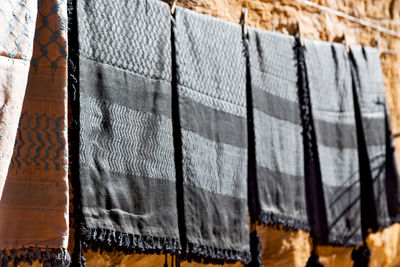 Close-up of clothes hanging on wall