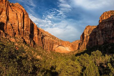 View of rock formations against cloudy sky