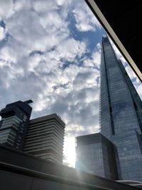 Low angle view of modern buildings against sky