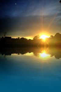 Scenic view of lake at sunset