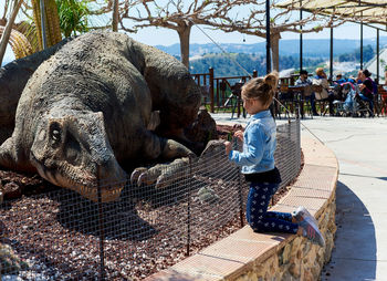 Full length of man feeding elephant