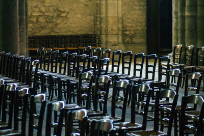 Close-up of empty chairs in row