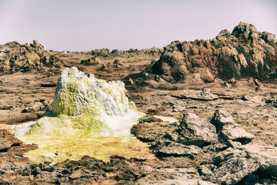 Scenic view of rock formations against sky