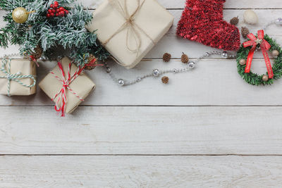 Close-up of christmas tree and gifts on table