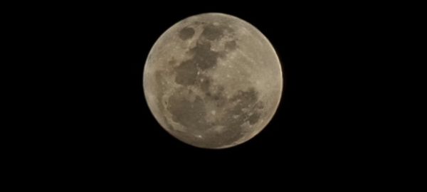 Scenic view of full moon against sky at night