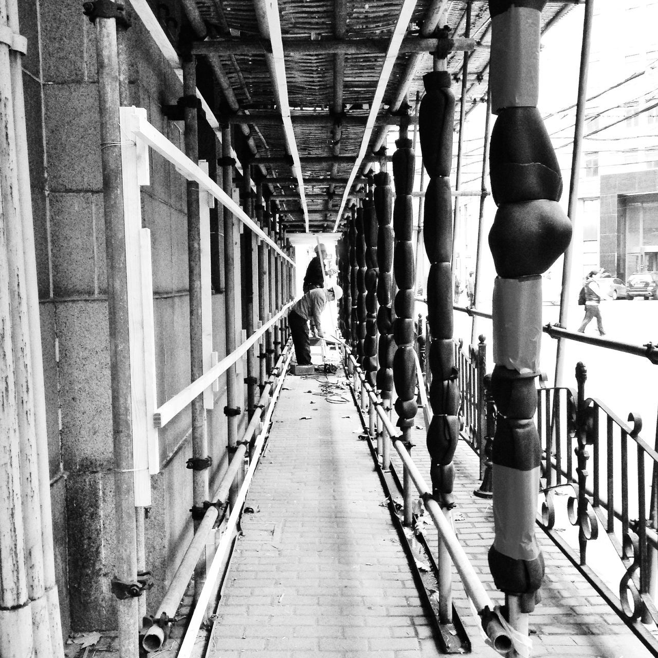 architecture, built structure, the way forward, walking, building exterior, men, diminishing perspective, city, person, vanishing point, full length, narrow, lifestyles, alley, rear view, city life, transportation, walkway, building