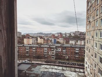 Buildings in city against sky