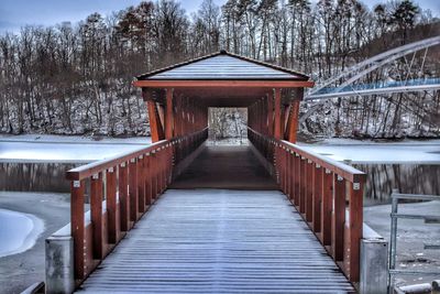 Footbridge over snow covered land