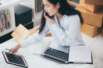 Woman using laptop on table