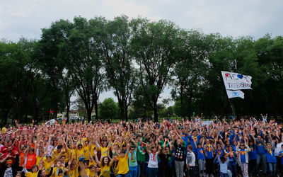 Crowd on field against sky