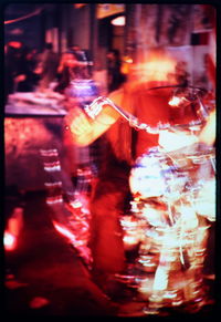 Blurred motion of woman at night