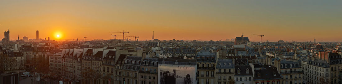 High angle view of buildings against sky during sunset