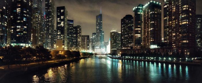 View of skyscrapers lit up at night