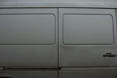 Gray car parts. wall machine. matte grey paint on metal. truck body.