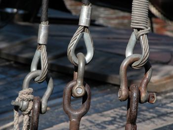 Close-up of chain tied up of rusty metal