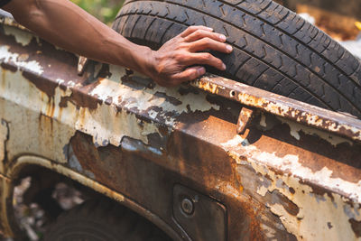 Man working on rusty metal