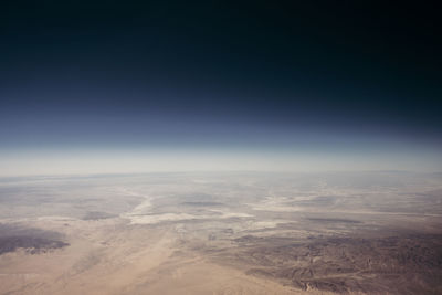 Aerial view of clouds over landscape against sky