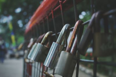 Close-up of padlocks on fence