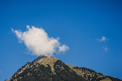 Low angle view of smoke stack against sky