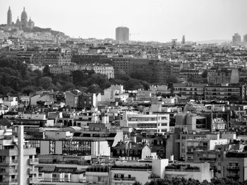 High angle view of buildings in city against clear sky