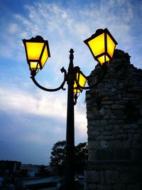 Low angle view of street light against sky