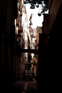 Alley amidst buildings in city