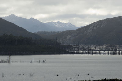 Scenic view of mountains against cloudy sky