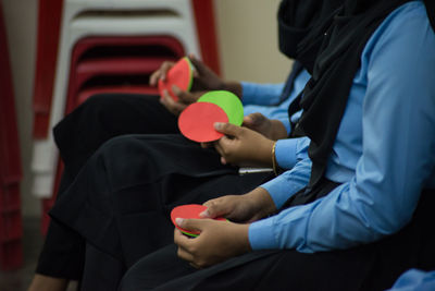 Close-up of woman holding hands
