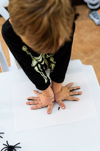 Midsection of girl studying at table