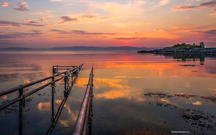 PIER ON SEA DURING SUNSET