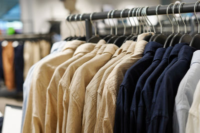Close-up of clothes hanging in store