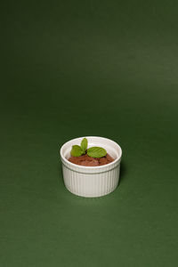 High angle view of food on table against green background