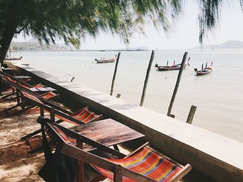 Boats on beach by sea