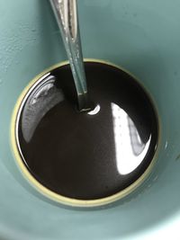 High angle view of coffee cup in water