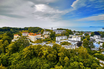 High angle view of trees and buildings against sky